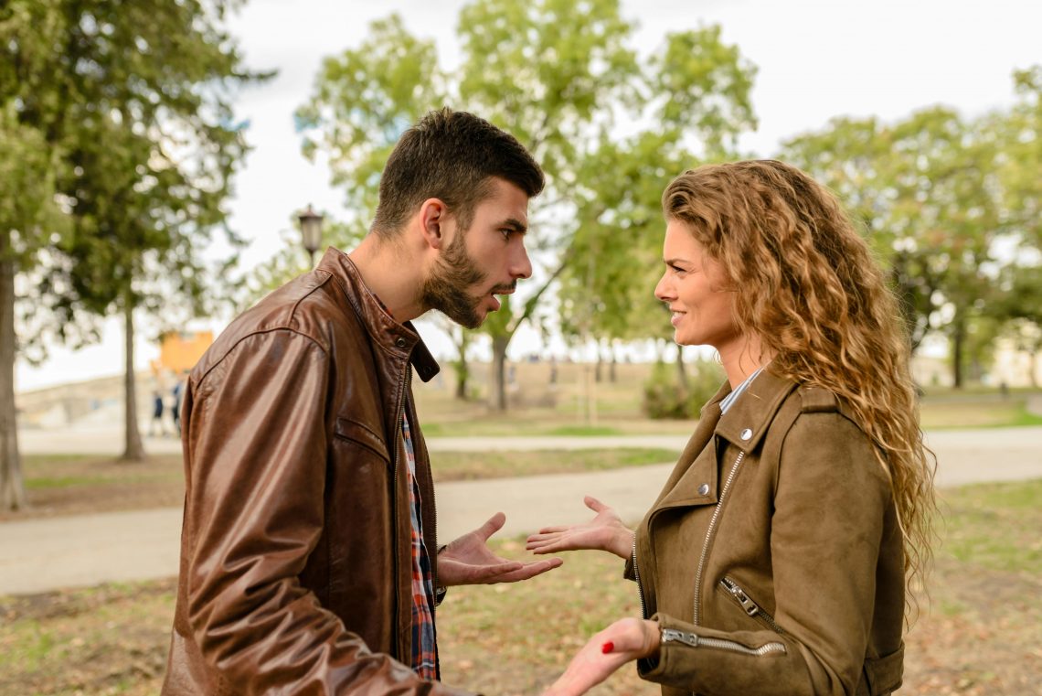 couple arguing in a park