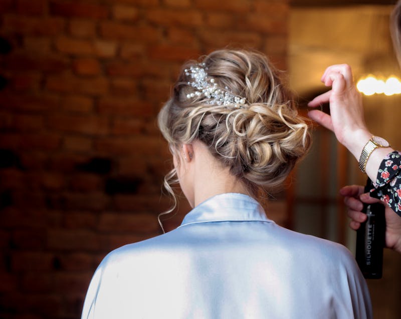a bride and her wedding hair stylist